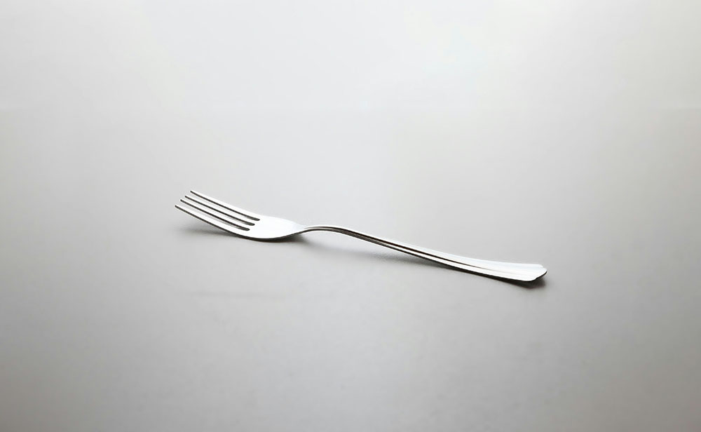 A fork on a dining room table